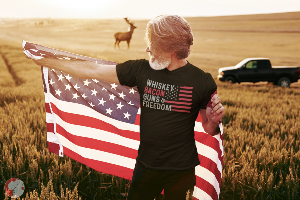 Bearded-elderly-man-posing-with-American-flag-wearing-a-bacon-shirt