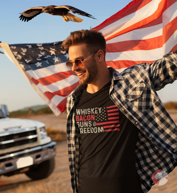 Fashionable-man-holding-an-American-flag-wearing-Whiskey-Bacon-Freedom-Shirt