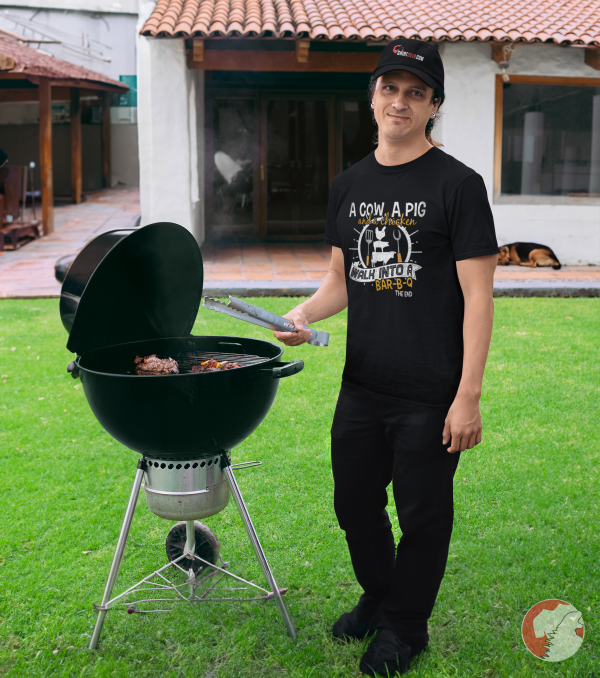 Man-wearing-dad-hat-grilling-at-BBQ-party-in-a-funny-grilling-shirt
